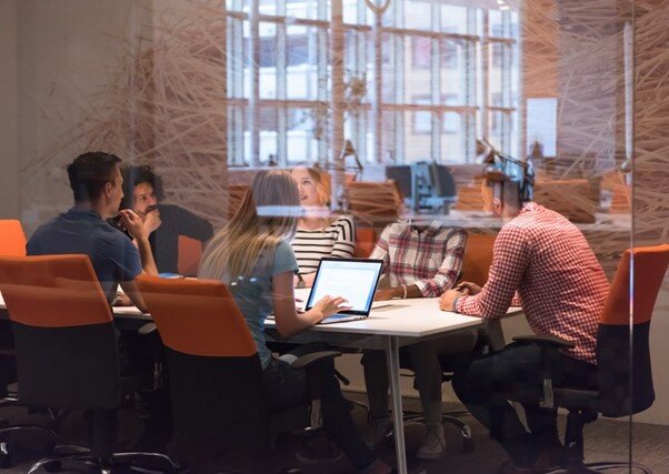 Young business-men and -women meeting