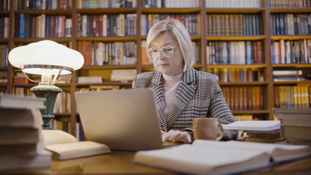 Women researching in a library